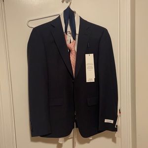 Navy blue suit blazer size 36s and pants 30L, 30W from Calvin Klein